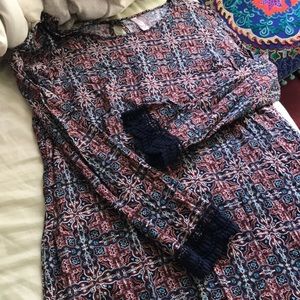 Tunic or dress hits above knee, lace trim sleeves